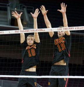 Aiming high · Freshman middle blocker Josh Kirchner (18) and redshirt sophomore outside hitter Joey Booth go for the block at the net. - Ralf Cheung | Daily Trojan 