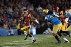 Adoree' Jackson runs for a gain on offense in USC's win over UCLA - Nick Entin | Daily Trojan