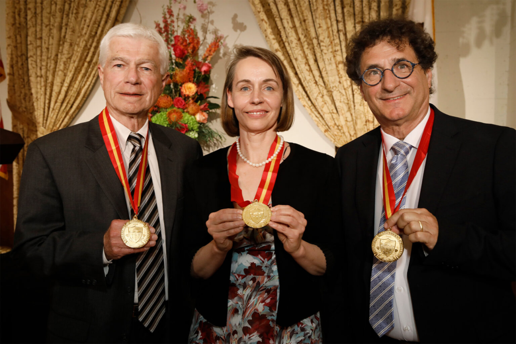 Dan Mazmanian (left), Dr. Sarah Van Orman (center) and Robert Cutietta (right) holding their medals.