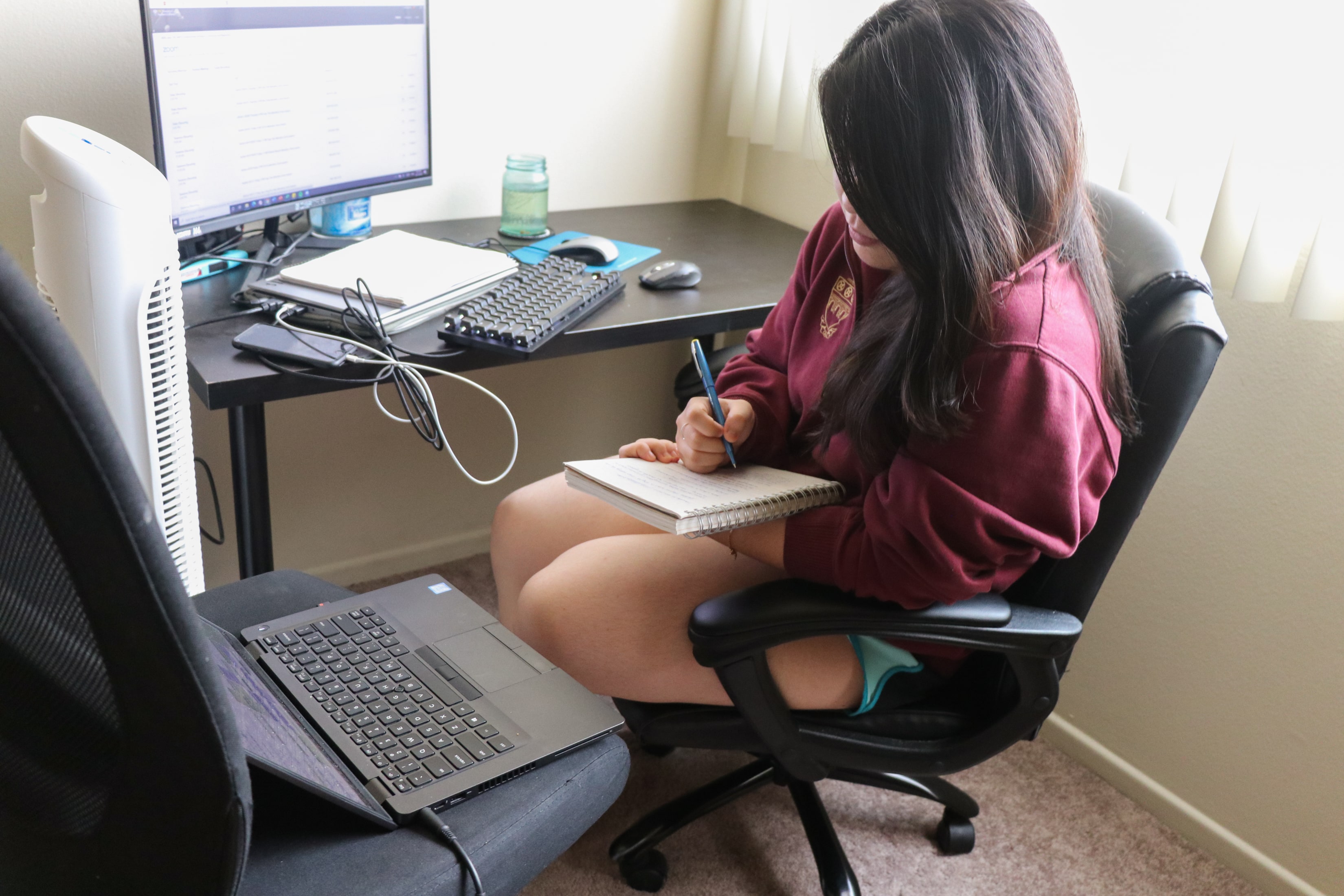 Person doing homework in workspace