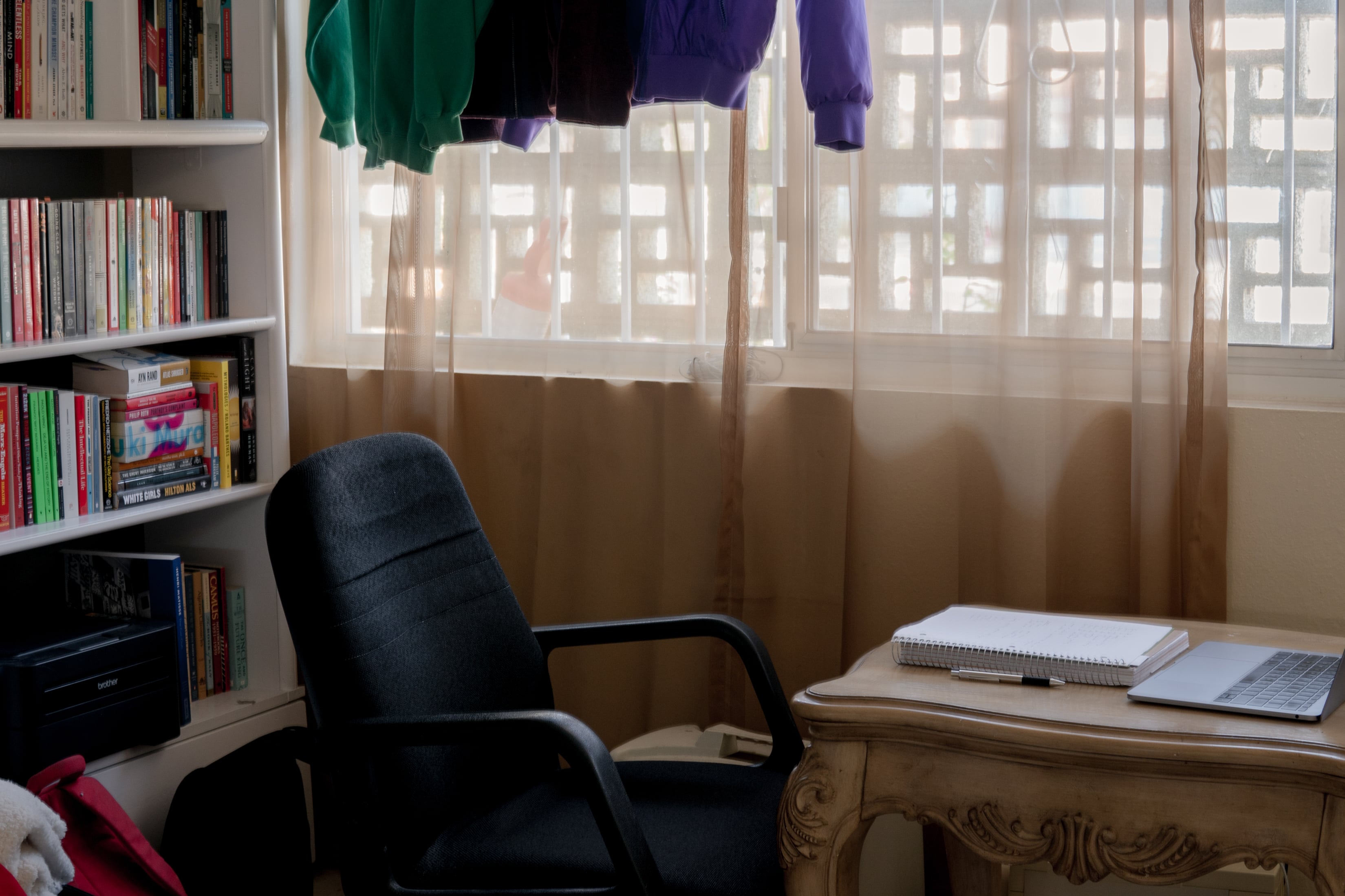 Workspace of chair, desk, and bookshelf