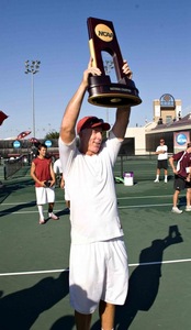 First at last · USC men’s tennis coach Peter Smith hoists the NCAA team championship trophy, USC’s 17th but Smith’s first. Coaching since he was 23, Smith had stints at three schools before he came to USC. - Photo courtesy of USC Sports Information