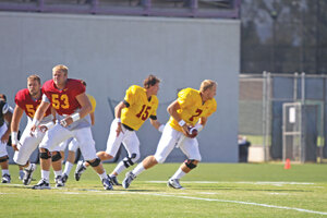 Back in action · Aaron Corp (15), practicing for the first time since cracking his fibula, must beat out Matt Barkley for the starting spot. - Mike Lee | Daily Trojan