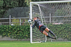 Not this time · Goalkeeper Kristin Olsen, pictured here making a save last season, was not so fortunate Saturday against the Aggies. - Pierson Clair | USC Sports Information 