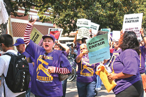 Negotiations · Members of USC’s maintenance staff, along with faculty and student supporters, march down Trousdale Parkway Wednesday. As they marched, the demonstrators held signs and chanted their demands for better contract terms from their employer, Aramark. - Dieuwertje Kast | Daily Trojan