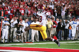 Galloping glory · Running back Stafon Johnson high steps into the end zone for a two-yard touchdown run to cap the fourth-quarter drive that gave the Trojans the go-ahead score. - Leah Thompson | Daily Trojan