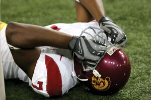 Shattered dreams · Former USC cornerback Cary Harris collapses in anguish after Oregon State shocked the Trojans in 2008. This year’s Trojans look to avoid the same mistake against Washington this week. -  Leah Thompson | Daily Trojan