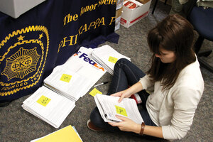 Bright ideas · Melissa Norman, a student worker for Academic Recognition Programs, sorts through the record 63 Fulbright applications sent in by USC students this year. - Mike Lee | Daily Trojan