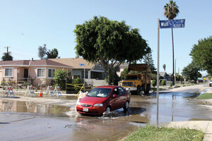 Old black water · A car plows through the water flooding the intersection of 83rd and Wall streets after a water main break on Tuesday. The USC Center on Megacities is working with the LA Department of Water and Power to find the source of the main breaks. - Mike Lee | Daily Trojan