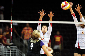 Season mark · Sophomore setter Kendall Bateman (12), seen here blocking at the net, set a career high last weekend with 60 assists. - Kim Young | Daily Trojan