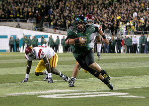 Running wild · Oregon quarterback Jeremiah Masoli torched the Trojan defense on the ground, rushing for 164 yards and one touchdown. - Dieuwertje Kast | Daily Trojan