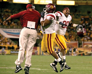 All smiles · Defensive tackle Derek Simmons (90) celebrates with Jurrell Casey (91) after a sack in USC’s final road contest of the season. - Leah Thompson | Daily Trojan