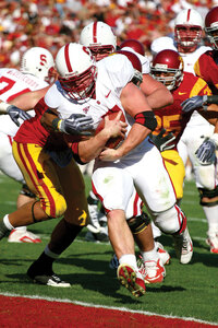 Heavy load · Running back Toby Gerhart plows through the USC defense for one of his three touchdowns in Stanford’s 55-21 victory. - Tim Tran | Daily Trojan