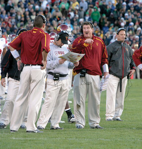 Hot seat · Trojan fans are not satisfied with playcaller Jeremy Bates (center), but finding one person to blame is not so easy in football. - Dieuwertje Kast | Daily Trojan