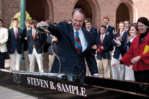 Wine to water · The men’s club crew team christened their new shell, the Steven B. Sample, in front of Bovard Auditorium on Wednesday. The team decided to dedicate the shell to the outgoing president in honor of his 19 years of leadership at USC. - Dieuwertje Kast | Daily Trojan