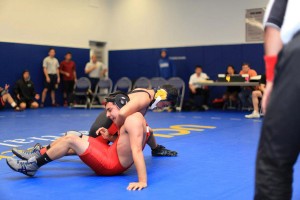 Making moves · Kasra Behizad, a sophomore majoring in health promotion and disease prevention studies, competes for the new club wrestling team in a recent meet against an opponent from UCLA.  - Courtesy of Nick Cegelski 