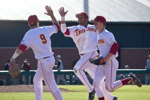 Upswing · USC freshman outfielder Timmy Robinson (center) has had plenty to cheer about after his recently snapped 12-game hitting streak. - Joseph Chen | Daily Trojan 