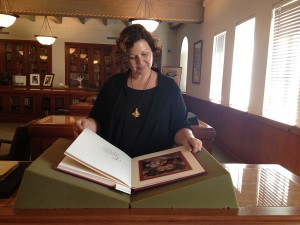 Bookworm · USC Libraries Special Collections archivist Michaela Ullmann glances over historical poems at Doheny Memorial Library. - Deena Khattab | Daily Trojan 