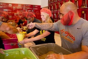 Teamwork · On Thursday, student athletes worked together to pack bags of rice for those affected by Typhoon Haiyan in the Philippines.  - Austin Vogel | Daily Trojan 