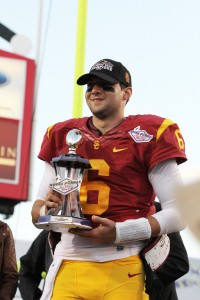 Victorious · Redshirt sophomore quarterback Cody Kessler poses with the Sun Bowl trophy after the Trojans secure their 10th win of the season. – Nick Entin | Daily Trojan