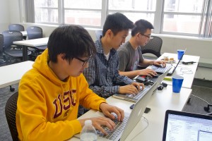 Techies · (From left to right): Undeclared sophomore Bryan Chong; sophomore Brian Chen, majoring in computer science games and freshman William Yeh, majoring in computer science work on their new software app. - Austin Vogel | Daily Trojan 
