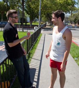 Greek ally · IFC Director of Diversity Sebastian Maya hands out an advocacy button to junior Jim Stone at the Pi Kappa Phi fraternity house. - Austin Vogel | Daily Trojan 