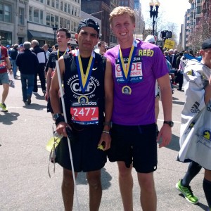 Just keep running · Adrian Broca (left), a blind runner, and Reed Semcken (right), a senior majoring in business administration, pose for a picture after the 2014 Boston Marathon, which was held on Monday, April 21.  - Photo courtesy of Reed Semcken 
