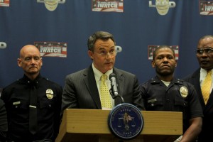 USC Senior VP of Administration Todd R. Dickey (second from left) addresses the media at Monday's press conference. Dickey stated that "nothing is off the table" when it came to the safety of USC's students.