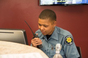 On guard · Takoyah Penny, Dept. of Public Safety Community Service Officer, listens to a radio communication during her shift. DPS has increased its number of security ambassadors this year. - Mariya Dondonyan | Daily Trojan 