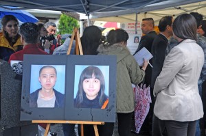 In trial · Photos of Ming Qu and Ying Qu, the victims of a 2012 murder, are shown at a press conference. Javier Bolden is on trial for the killings. - Daily Trojan File Photo 