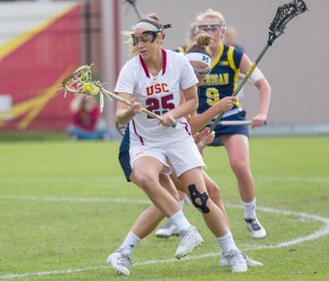 A scorching start · Senior attacker Caroline deLyra pivots in a game against Michigan in March. The women’s lacrosse team is 11-0 this season. - Brian Ji | Daily Trojan 