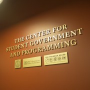 Against a brown wall are the words "The Center for Student Government and Programming."