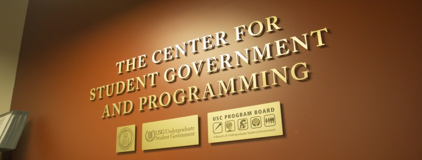 Against a brown wall are the words "The Center for Student Government and Programming."