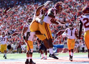 USC tight end Daniel Imatorbhebhe celebrates with a teammate after scoring a touchdown against Arizona on Saturday, Oct. 15 in Tucson, Ariz. - Sydney Richardson / The Daily Wildcat