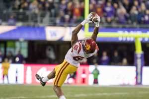 Daniel Imatorbhebhe makes a leaping catch in the win over Washington. He had five catches in the night. - Nick Entin | Daily Trojan