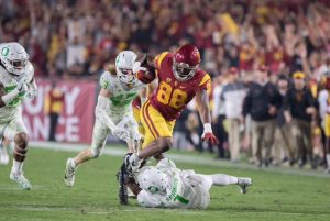 Daniel Imatorbhebhe pulls down a catch from Sam Darnold - Trevor Sochocki | Daily Trojan 