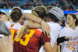 Senior Katie Johnson celebrates with her teammates on the field before the trophy presentation. Johnson scored the game-winning goals in the semifinal and the final, earning the offensive Most Outstanding Player award of the College Cup - Photo courtesy Madeleine Roche 