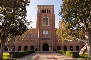 An image of the building Bovard on campus, showing its red brick entrance