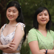 Jade Lee standing to the left with Jaclyn Dong to the right and both their arms folded