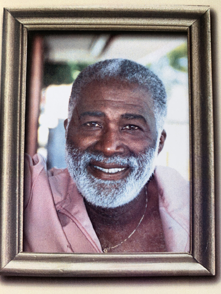 A portrait of a smiling man.