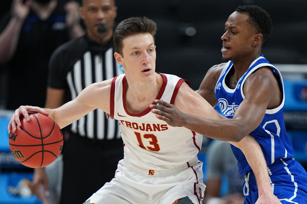 Junior guard Drew Peterson shoulders a Drake guard in the first round of the NCAA Tournament.