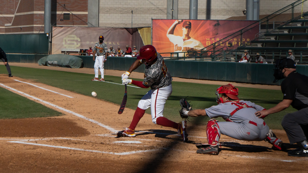 Tyresse Turner swinging at a pitch against LMU in a USC baseball game. 