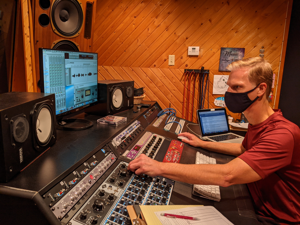 An image of business owner Paul Tavenner in a sound mixing studio.