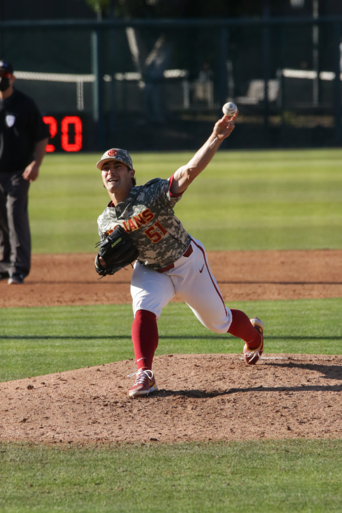 Quentin Longrie throwing a pitch from the mound in a game against Pepperdine.