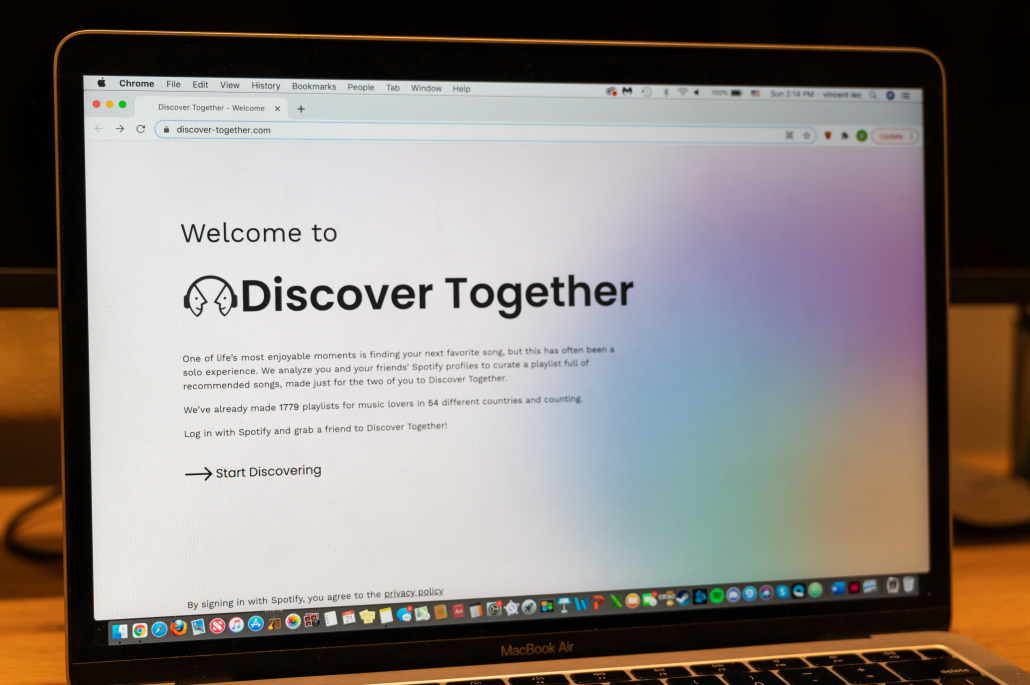 Laptop open to home page of Discover Together's website. 