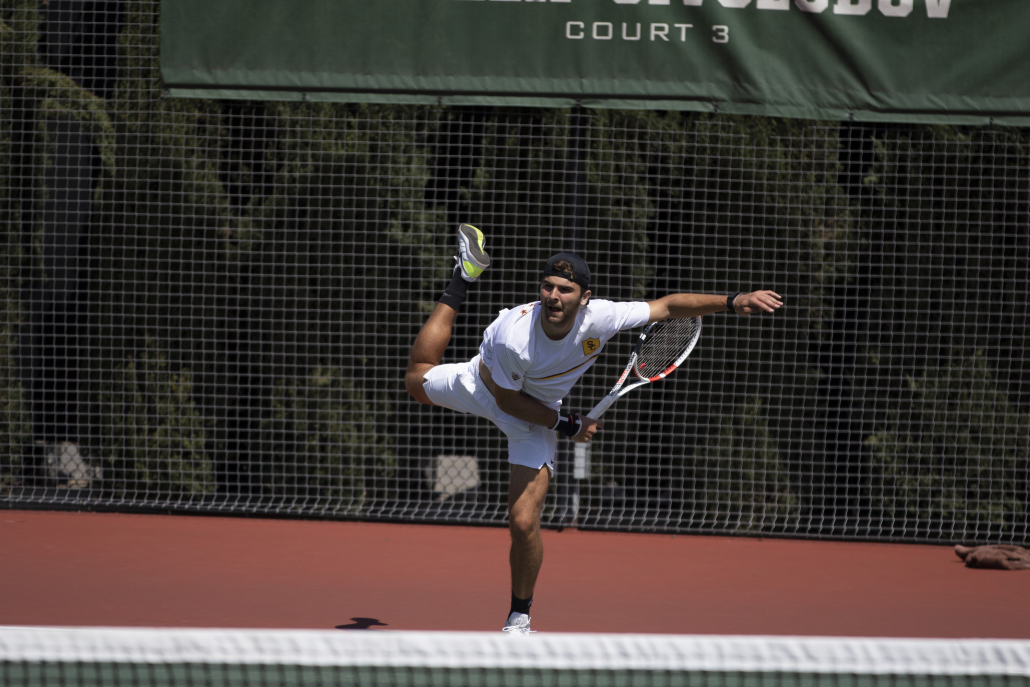 Sophomore Stefan Dostanic following through on a serve 