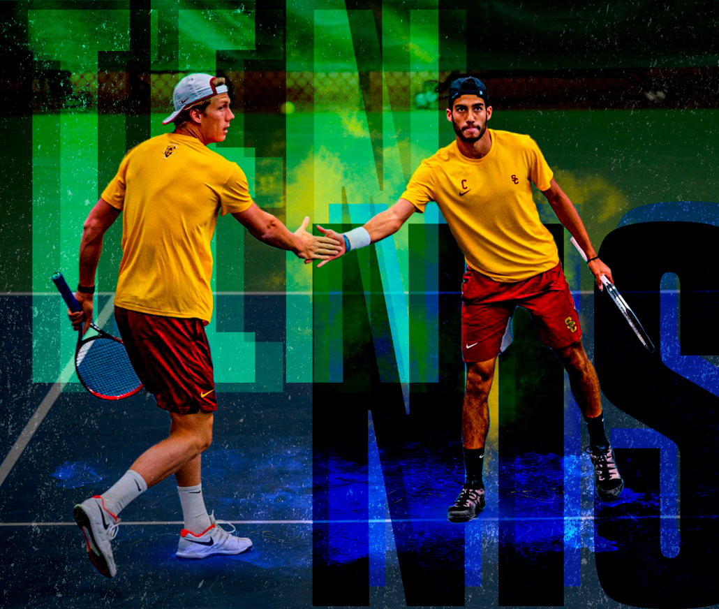 Holding their rackets, men's tennis duo Daniel Cukierman and Riley Smith high five after a point during a tennis match. In the background, the word tennis is displayed in large, bold font behind the players.