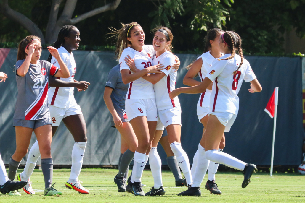 The Trojans celebrate together after a goal in a match against California State University, Northridge.