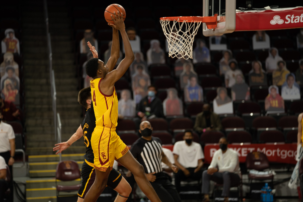 Evan Mobley attempts to dunk the ball during a game against Arizona State.