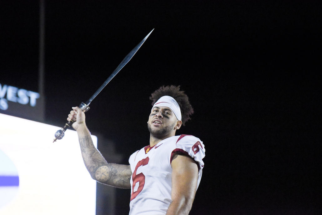 Michael Pittman Jr. holds the victory sword after a game.